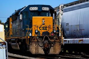 CSX railroad profit slips 2% as shipping demand remained weak and severance costs hurt results