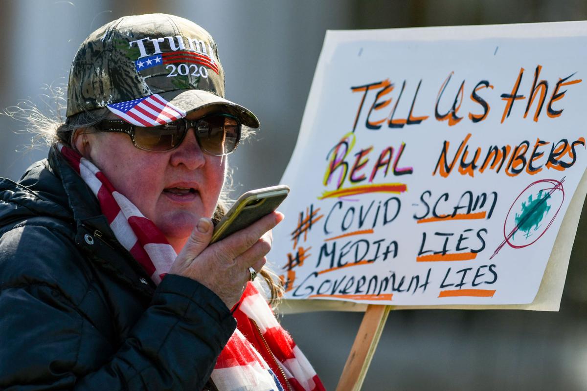 Protesters gather outside Gov. Charlie Baker's home in Swampscott