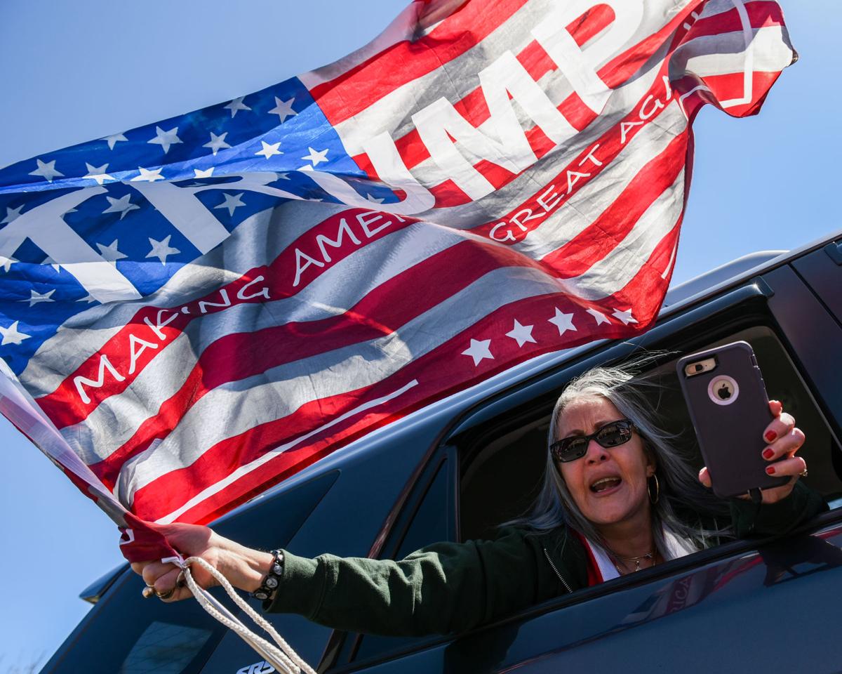 Protesters gather outside Gov. Charlie Baker's home in Swampscott