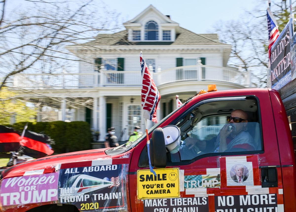Protesters gather outside Gov. Charlie Baker's home in Swampscott