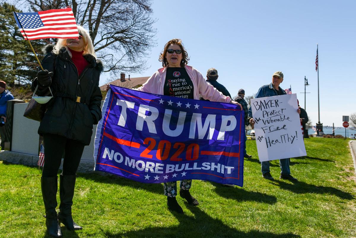 Protesters gather outside Gov. Charlie Baker's home in Swampscott