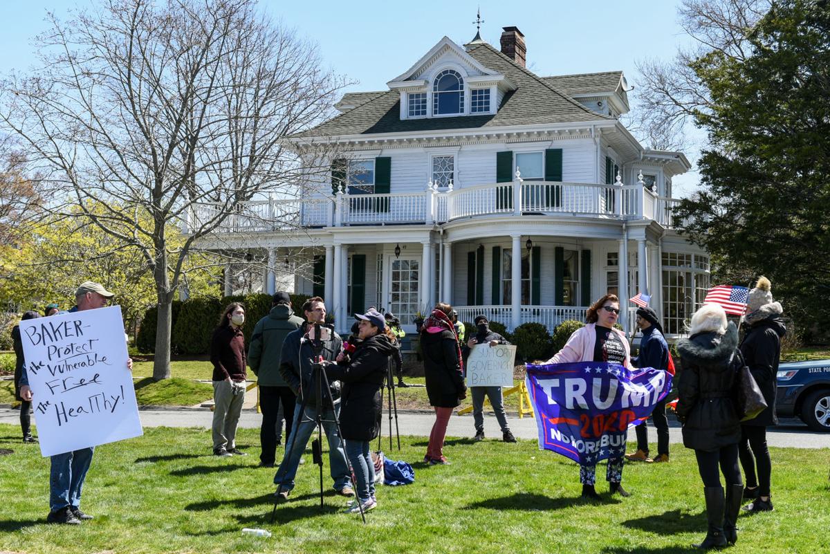 Protesters gather outside Gov. Charlie Baker's home in Swampscott