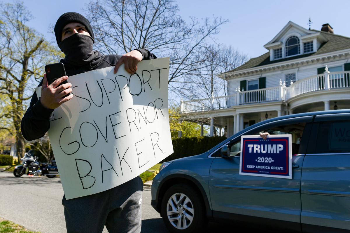 Protesters gather outside Gov. Charlie Baker's home in Swampscott