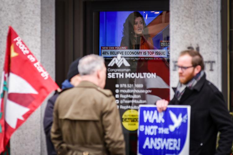 Massachusetts Peace Action members protest war in Ukraine outside Congressman Moulton’s office