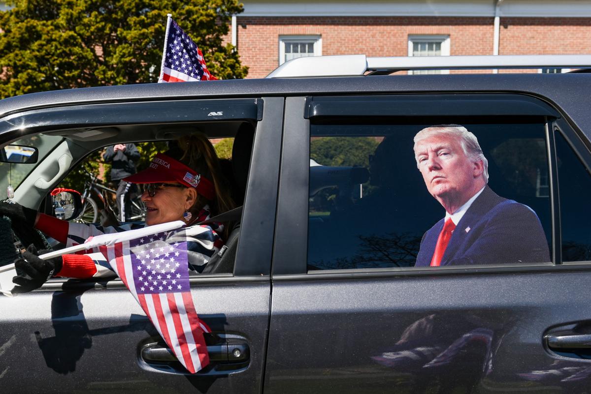 Protesters gather outside Gov. Charlie Baker's home in Swampscott
