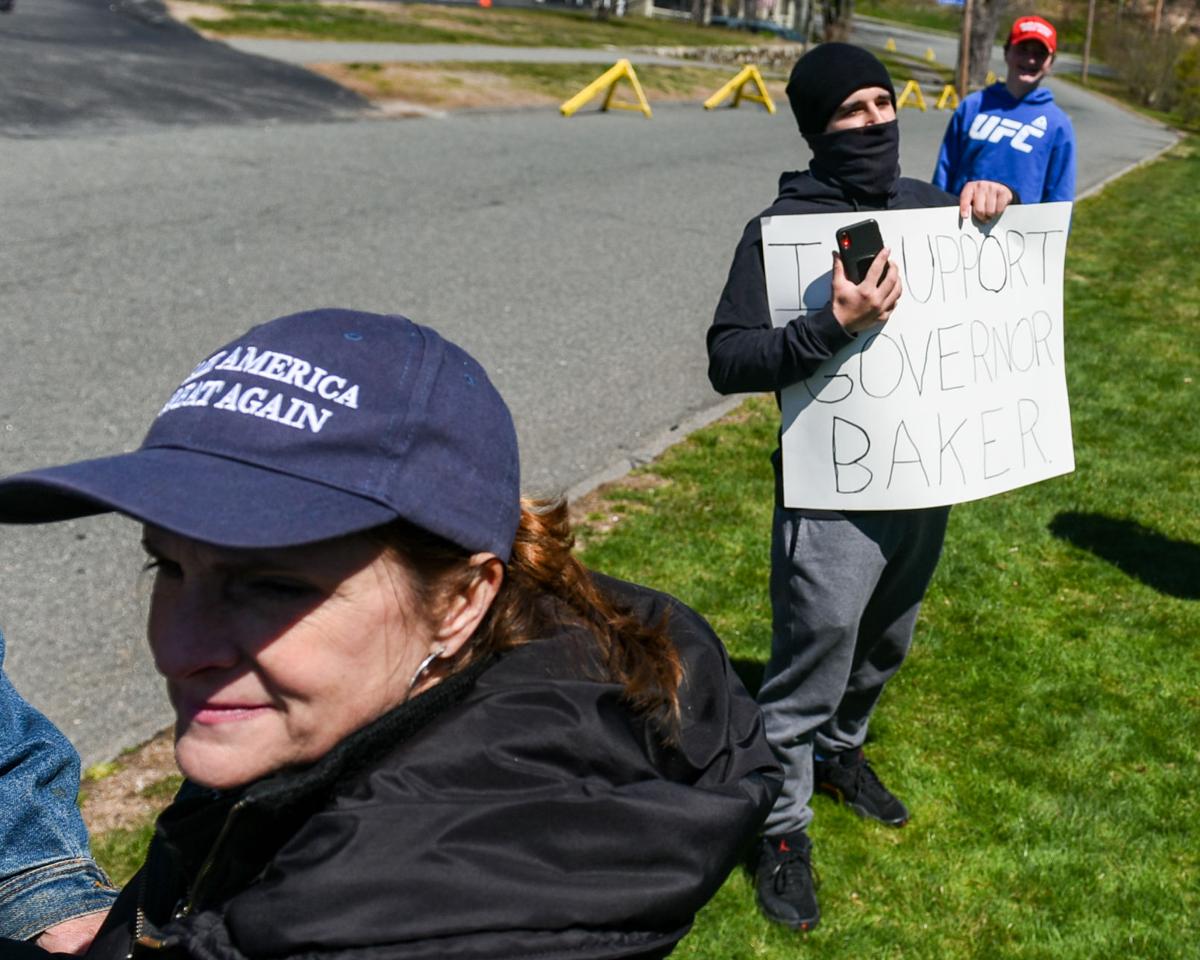 Protesters gather outside Gov. Charlie Baker's home in Swampscott