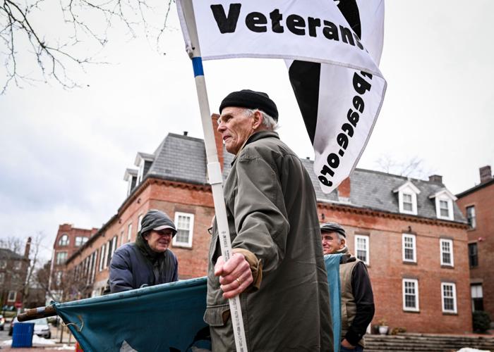 Massachusetts Peace Action members protest war in Ukraine outside Congressman Moulton’s office