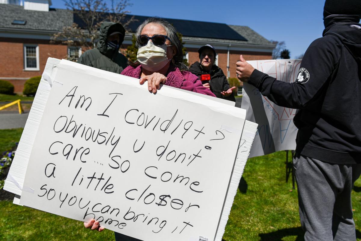 Protesters gather outside Gov. Charlie Baker's home in Swampscott