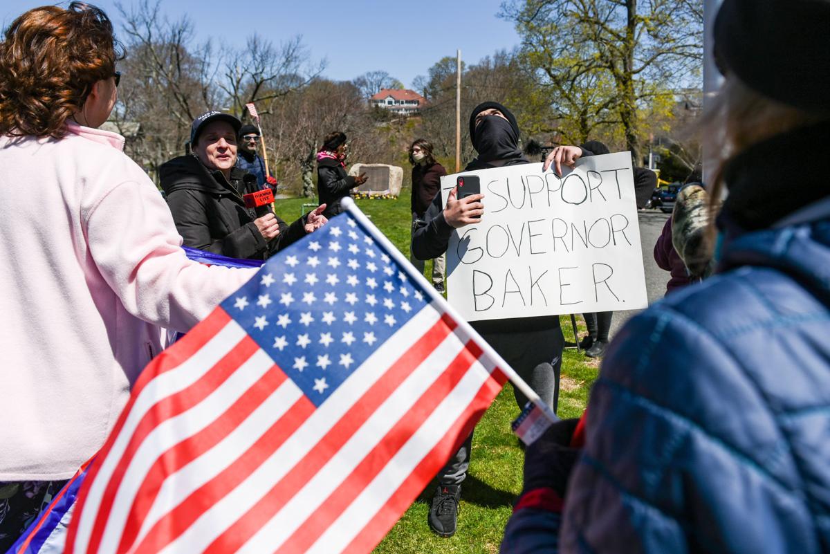 Protesters gather outside Gov. Charlie Baker's home in Swampscott