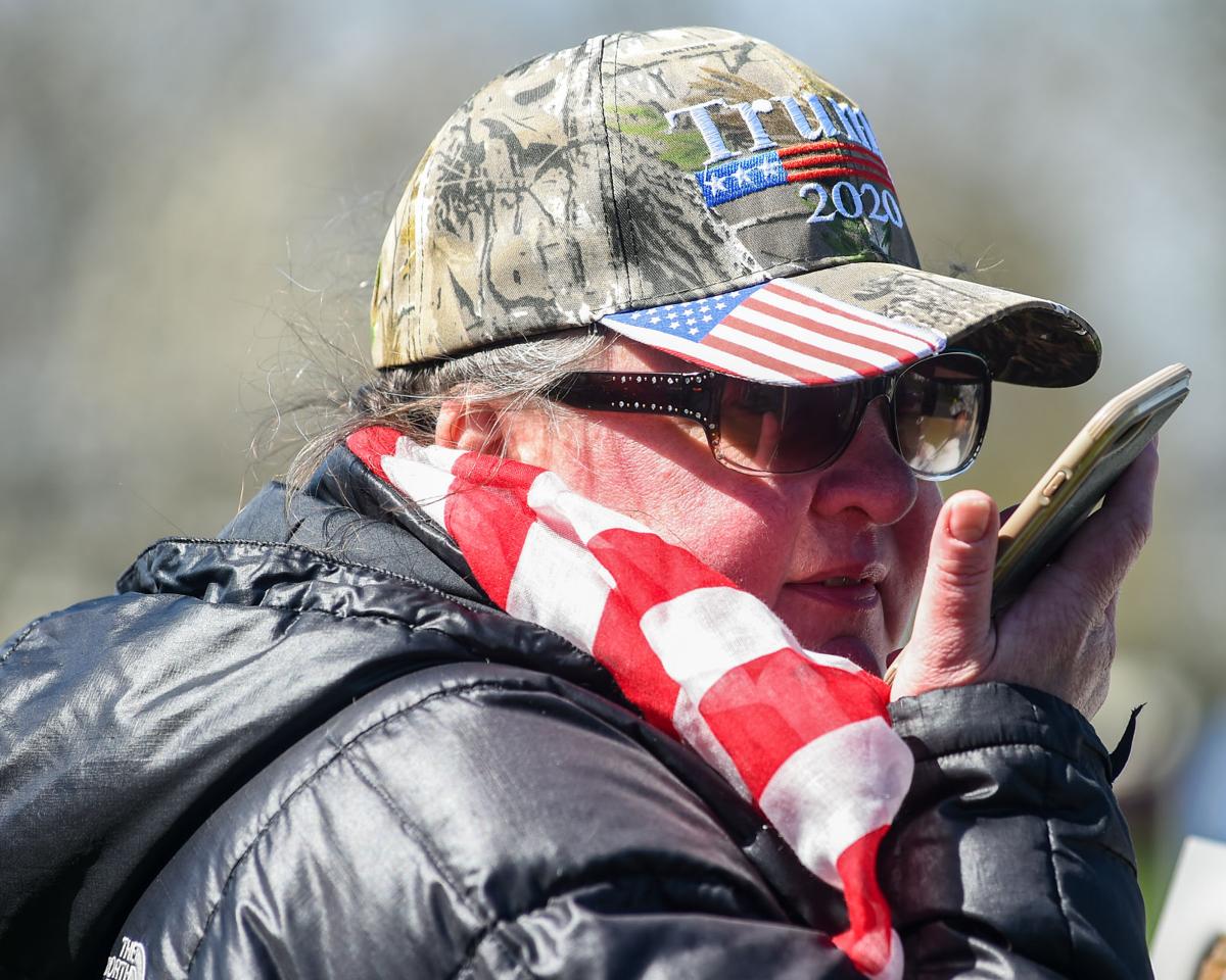Protesters gather outside Gov. Charlie Baker's home in Swampscott