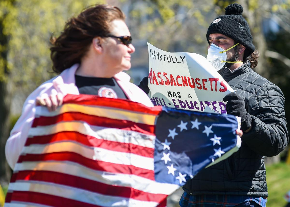 Protesters gather outside Gov. Charlie Baker's home in Swampscott