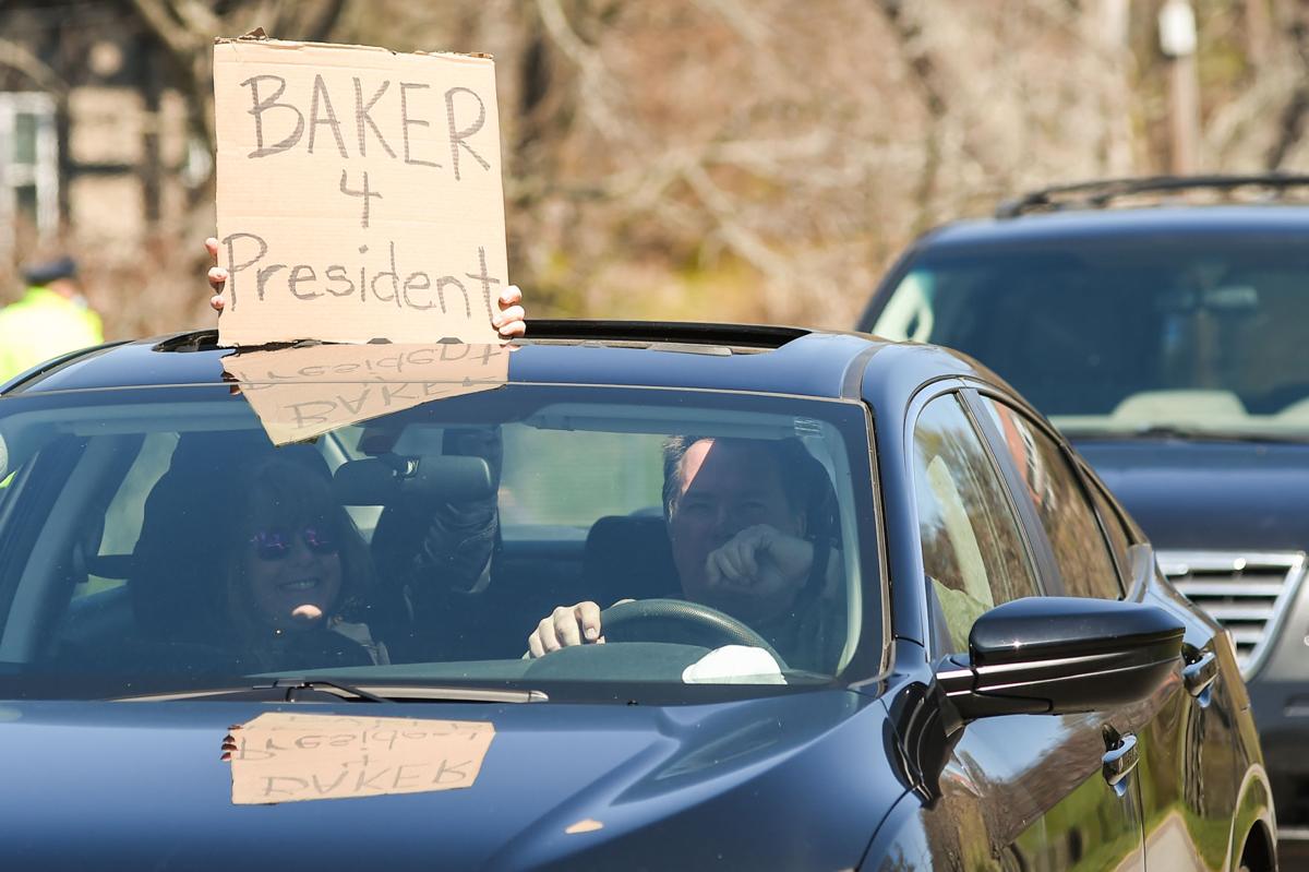 Protesters gather outside Gov. Charlie Baker's home in Swampscott