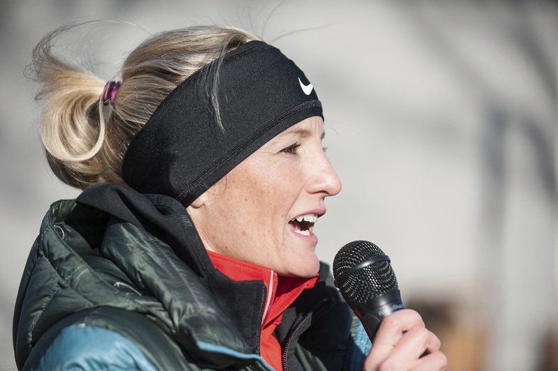 Shalane Flanagan speaks to a large crowd outside the Marblehead Community Center before the start of the first Back the Track 5K.
