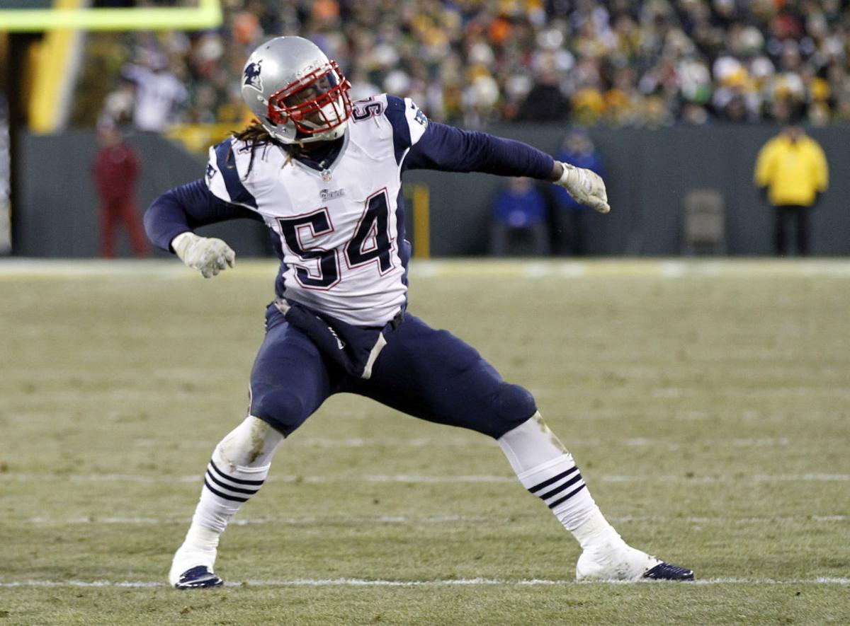 New England Patriots' Dont'a Hightower reacts after sacking Green Bay Packers quarterback Aaron Rodgers during the first half.