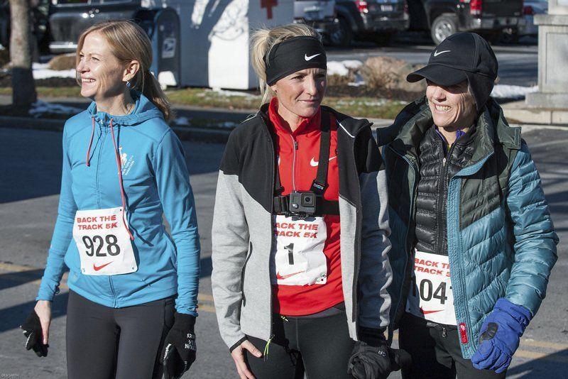 From left, Mary Wittenberg, the chief executive of New York Road Runners, stands with Marblehead native and three-time Olympian Shalane Flanagan and Joan Benoit Samuelson, who won gold at the 1984 Summer Olympics in Los Angeles. All were in Marblehead to support the Back the Track 5K Nov. 29.