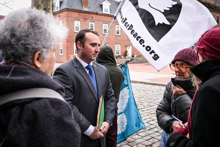 Massachusetts Peace Action members protest war in Ukraine outside Congressman Moulton’s office