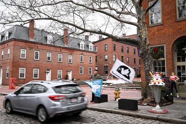Massachusetts Peace Action members protest war in Ukraine outside Congressman Moulton’s office