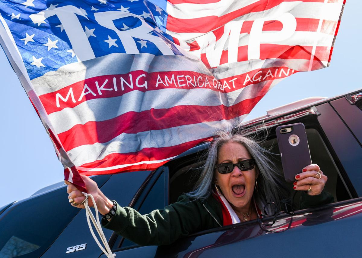Protesters gather outside Gov. Charlie Baker's home in Swampscott