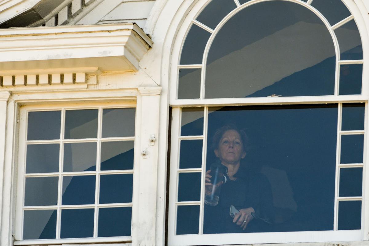 Protesters gather outside Gov. Charlie Baker's home in Swampscott