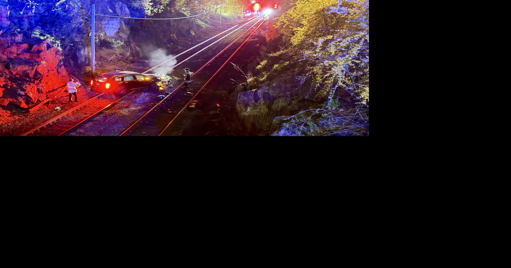 Man arrested after vehicle rolls down Beverly embankment, onto tracks