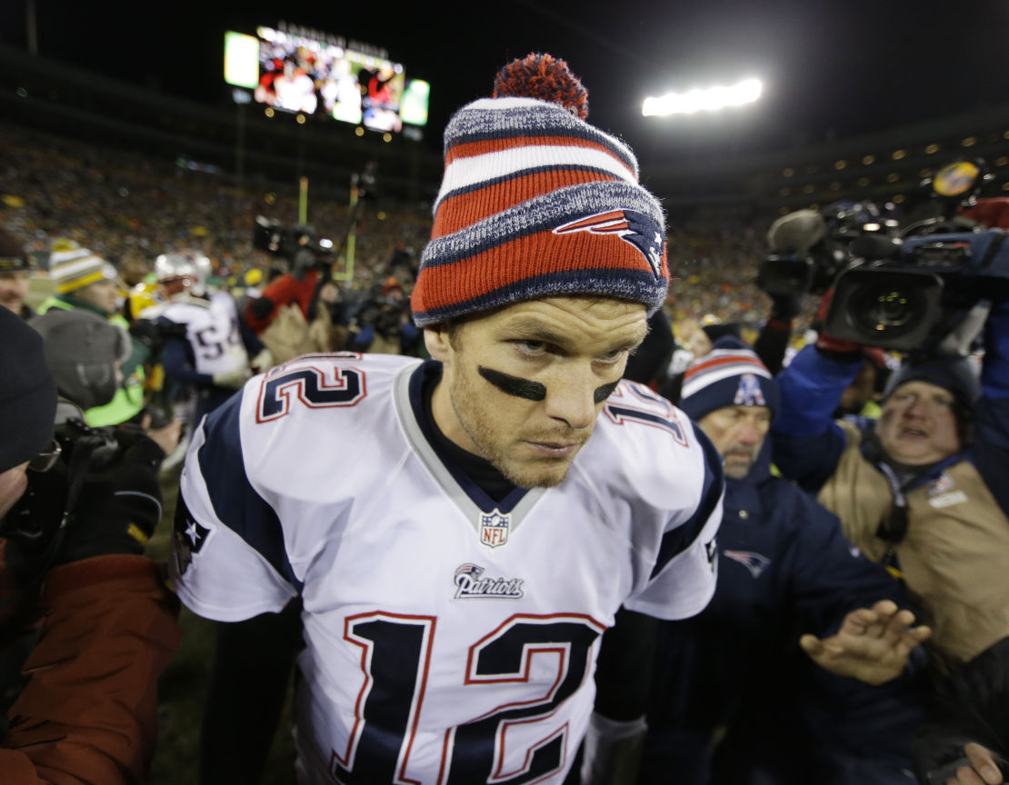 New England Patriots' Tom Brady walks off the field after the game.
