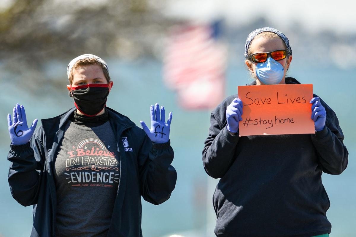 Protesters gather outside Gov. Charlie Baker's home in Swampscott