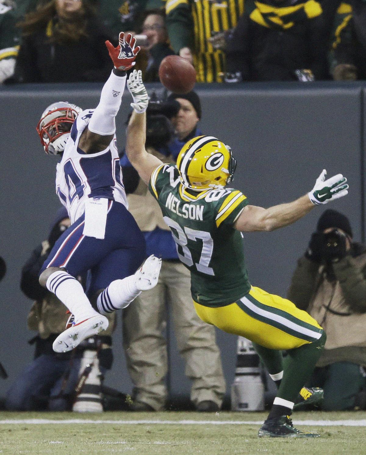 New England Patriots' Darrelle Revis breaks up a pass intended for Green Bay Packers' Jordy Nelson during the first half.