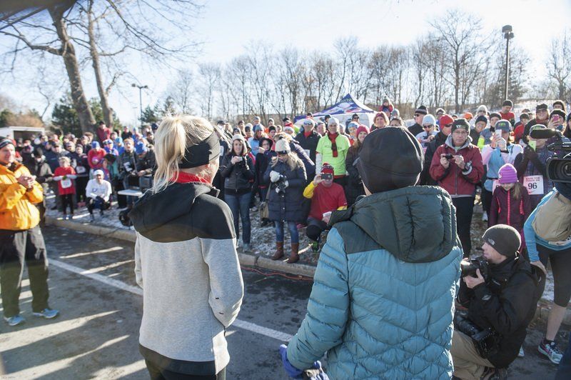 Marblehead native and three-time Olympian Shalane Flanagan (left) and Joan Benoit Samuelson, who won gold at the 1984 Summer Olympics in Los Angeles, both speak to a large crowd outside the Marblehead Community Center.