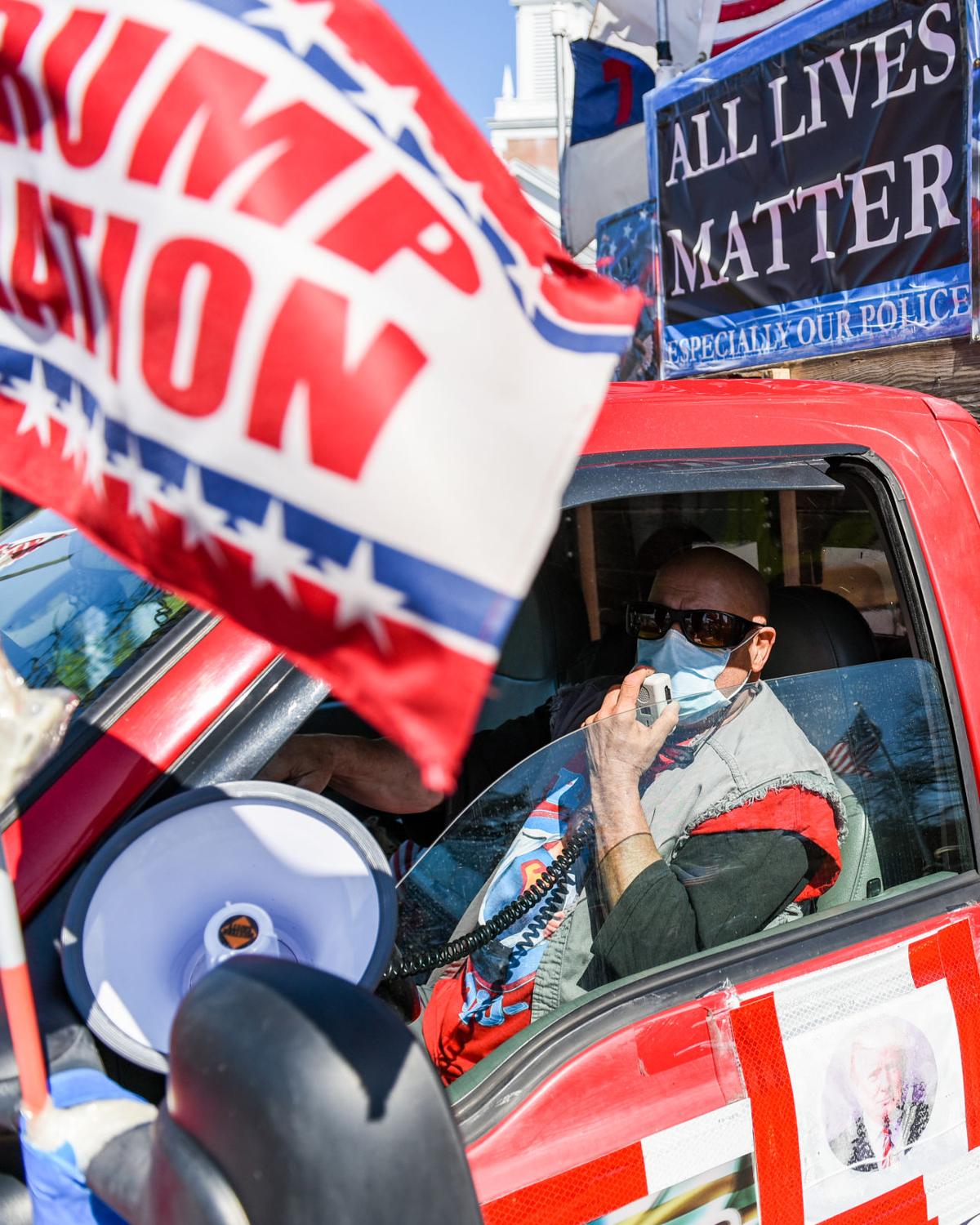 Protesters gather outside Gov. Charlie Baker's home in Swampscott