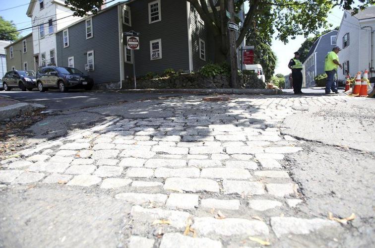 Historic cobblestones hit a bumpy patch River Street neighbors like historic look, but city has other concerns  