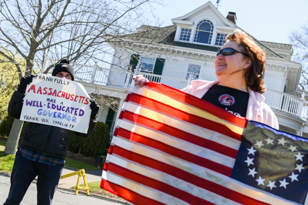 Protesters gather outside Gov. Charlie Baker's home in Swampscott