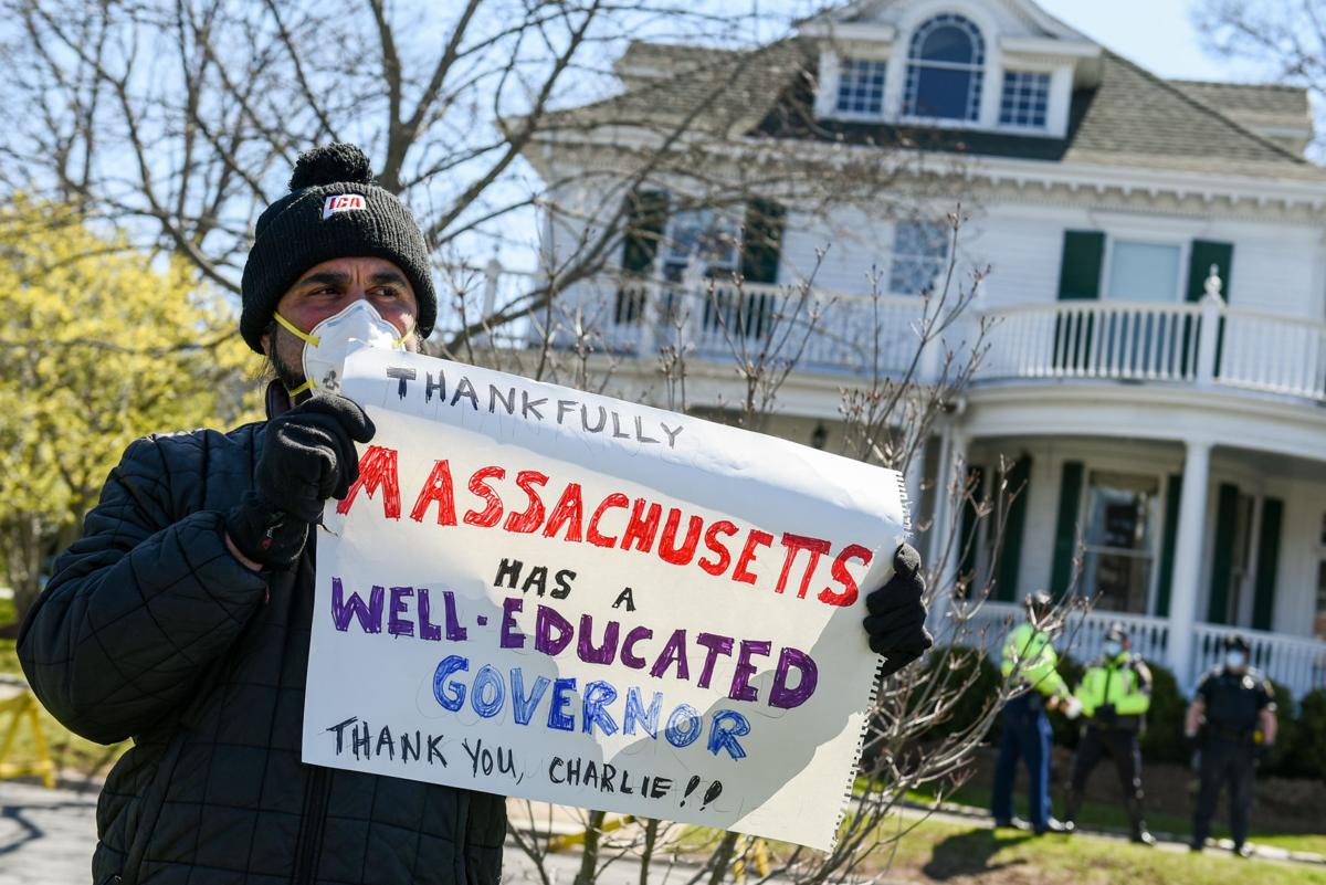 Protesters gather outside Gov. Charlie Baker's home in Swampscott