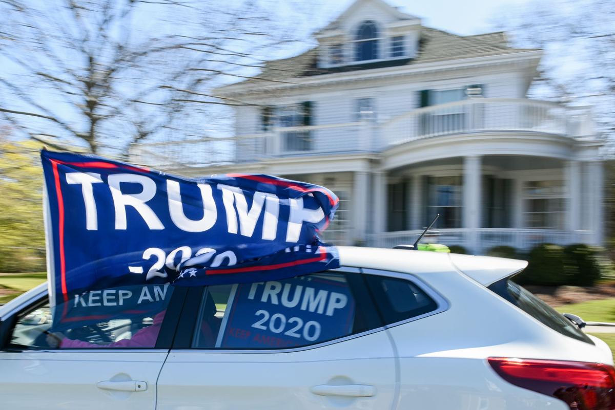Protesters gather outside Gov. Charlie Baker's home in Swampscott
