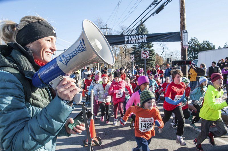 Marblehead native and three-time Olympian Shalane Flanagan is all smiles after calling the start of the Kids 1-Mile race outside the Marblehead Community Center.