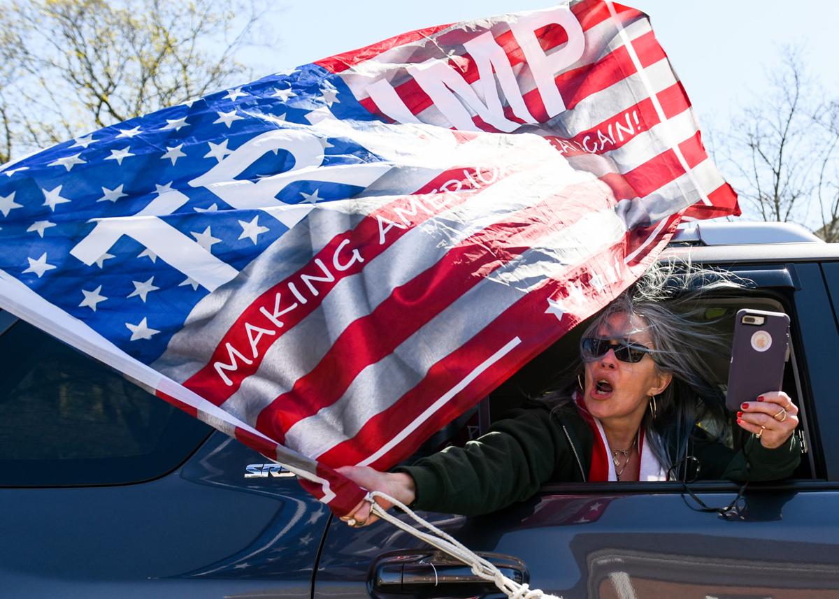 Protesters gather outside Gov. Charlie Baker's home in Swampscott