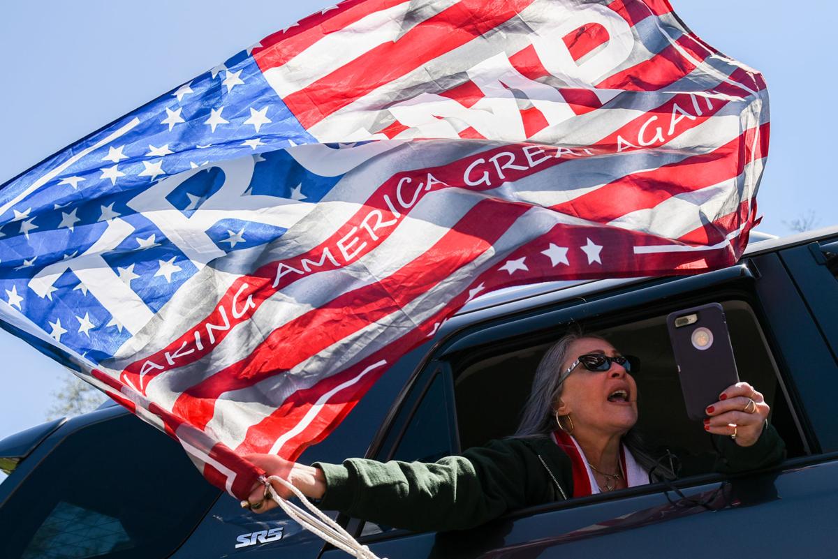 Protesters gather outside Gov. Charlie Baker's home in Swampscott