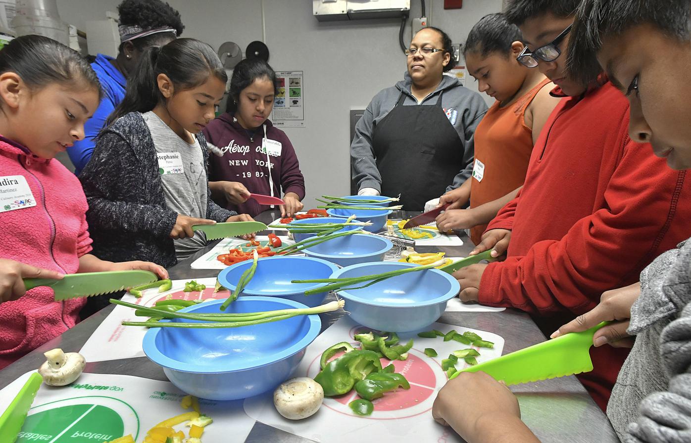Students head for the kitchen to see what's cooking at third annual