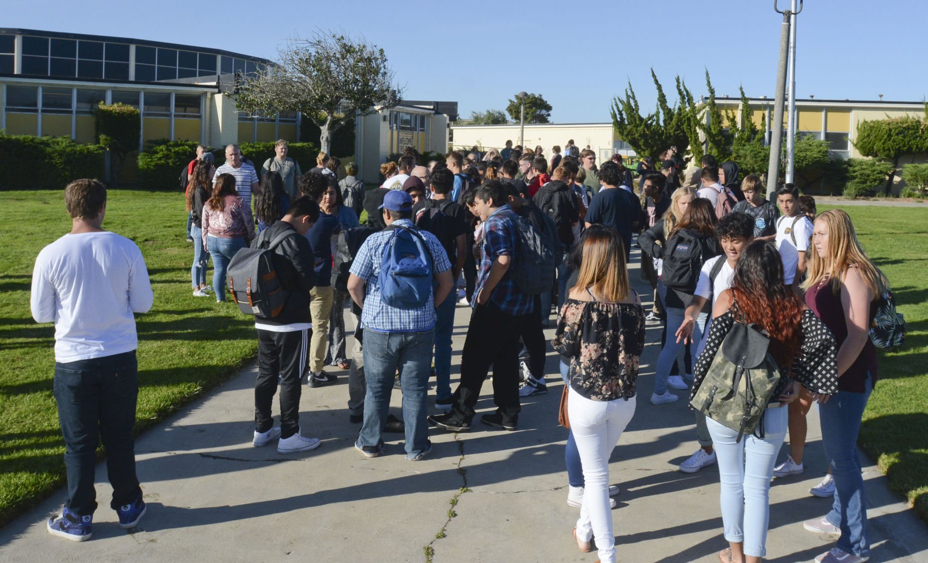 Cabrillo high scholl students faces in the street deals lamps