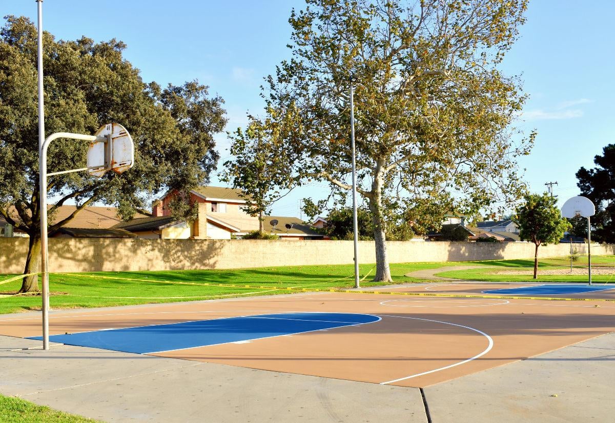 The freshly painted basketball courts behind the Minami Center nears completetion in Santa Maria.