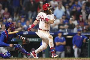 Marsh impulsa a Filis en la 11a y Kemp logra tres hits en victoria 4-3 sobre Cachorros