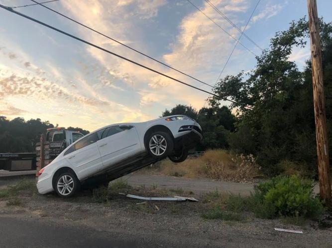 Car left partially suspended by cable after collision near Solvang