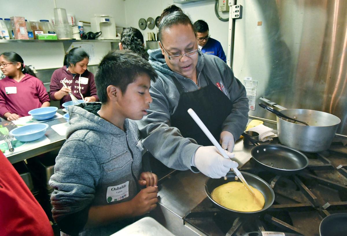Students head for the kitchen to see what's cooking at third annual