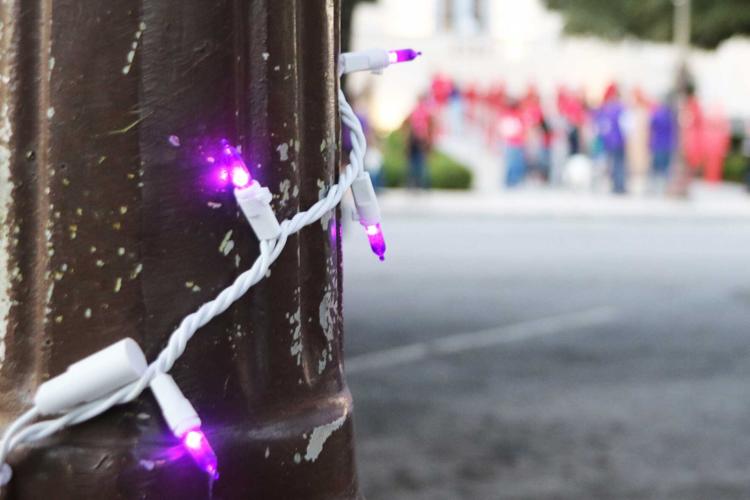 Community shines light on domestic violence at vigil | News ...