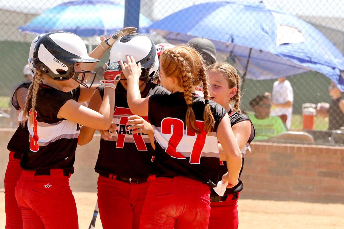 INTERNATIONAL AFFAIR Softball tournament brought teams across borders