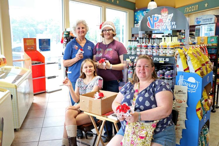 McQueeney VFW members handout poppies News