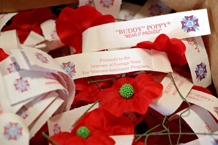 McQueeney VFW members handout poppies News