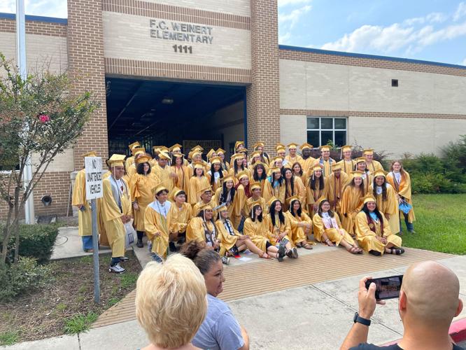 FINAL STROLL Area seniors take one last walk through their former