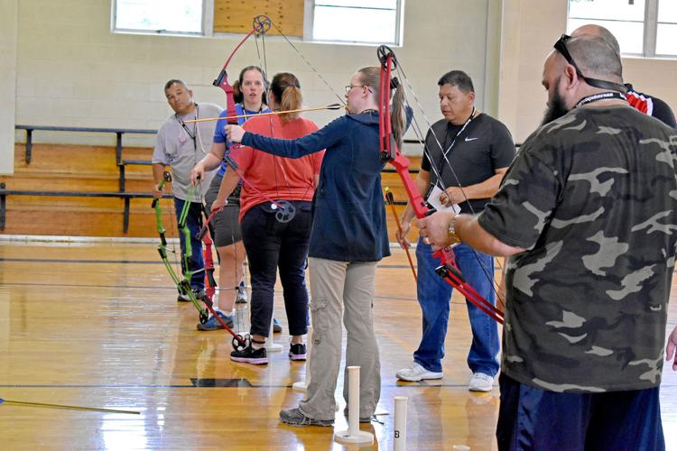 Area educators shoot to certified archery instructors to teach students News
