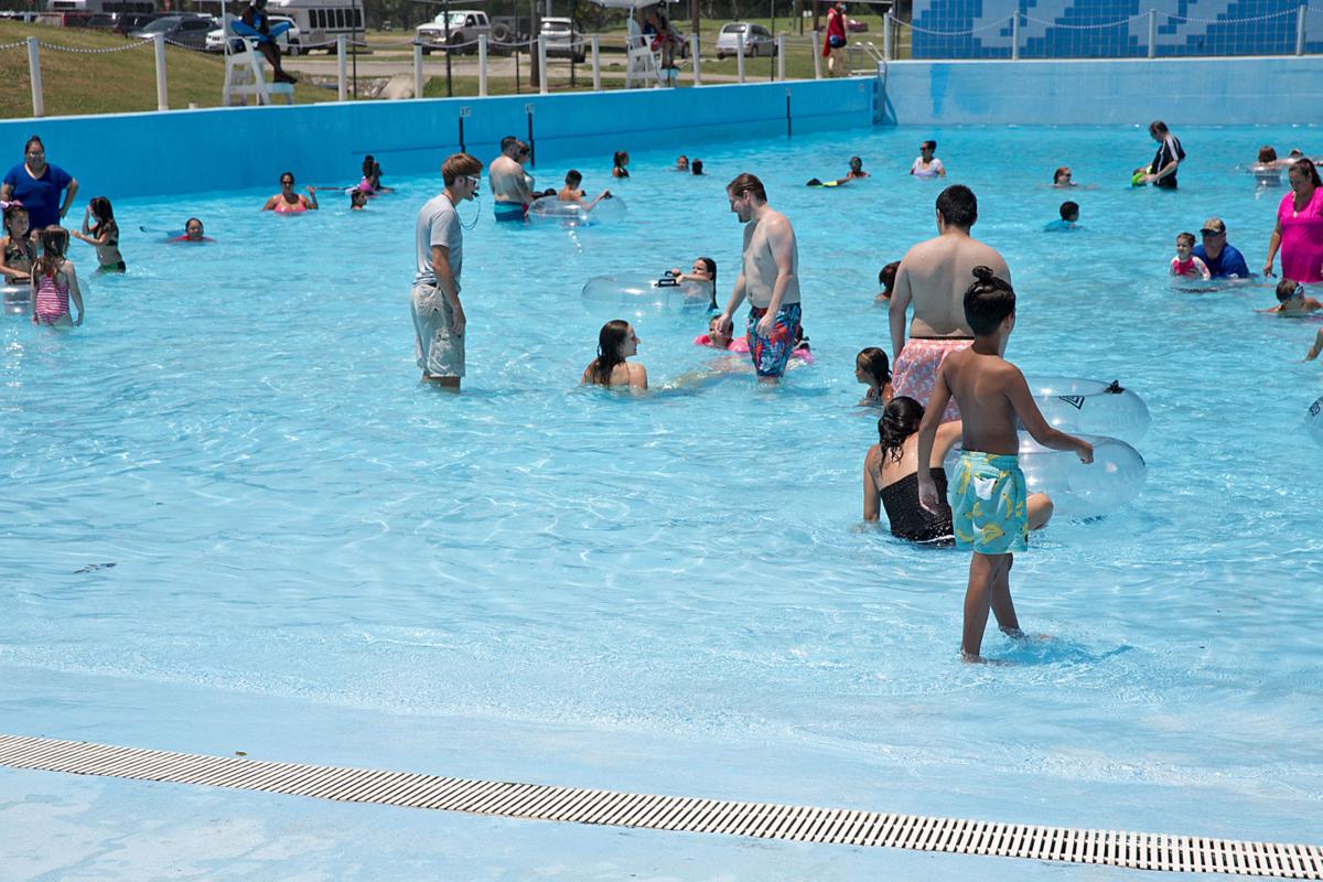 Magic Merment Mermaid chills in Seguin’s wave pool to beat the heat