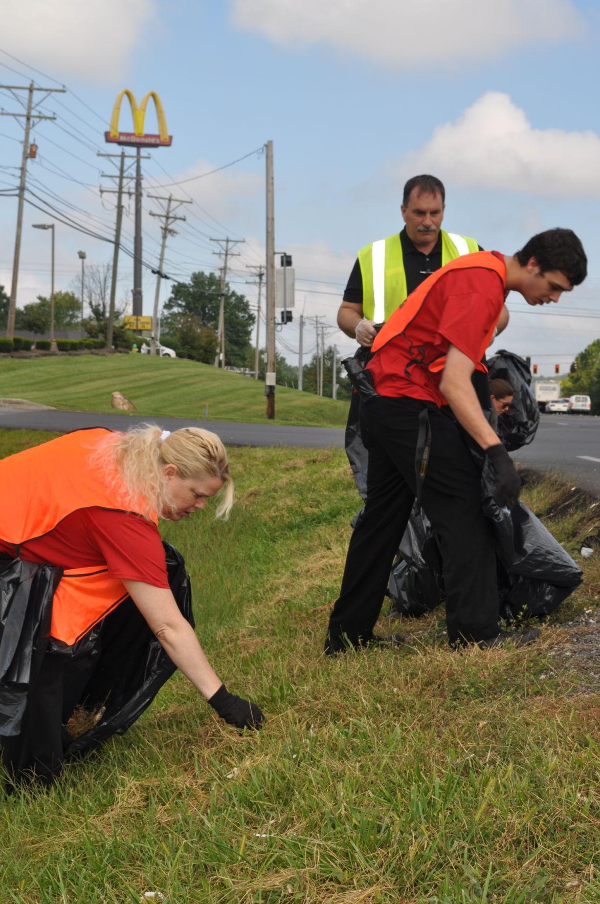McDonalds workers pick up trash as part of ‘Adopt a Highway’ program